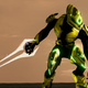 A neon-yellow elite stands ready with an energy sword in New Mombasa.